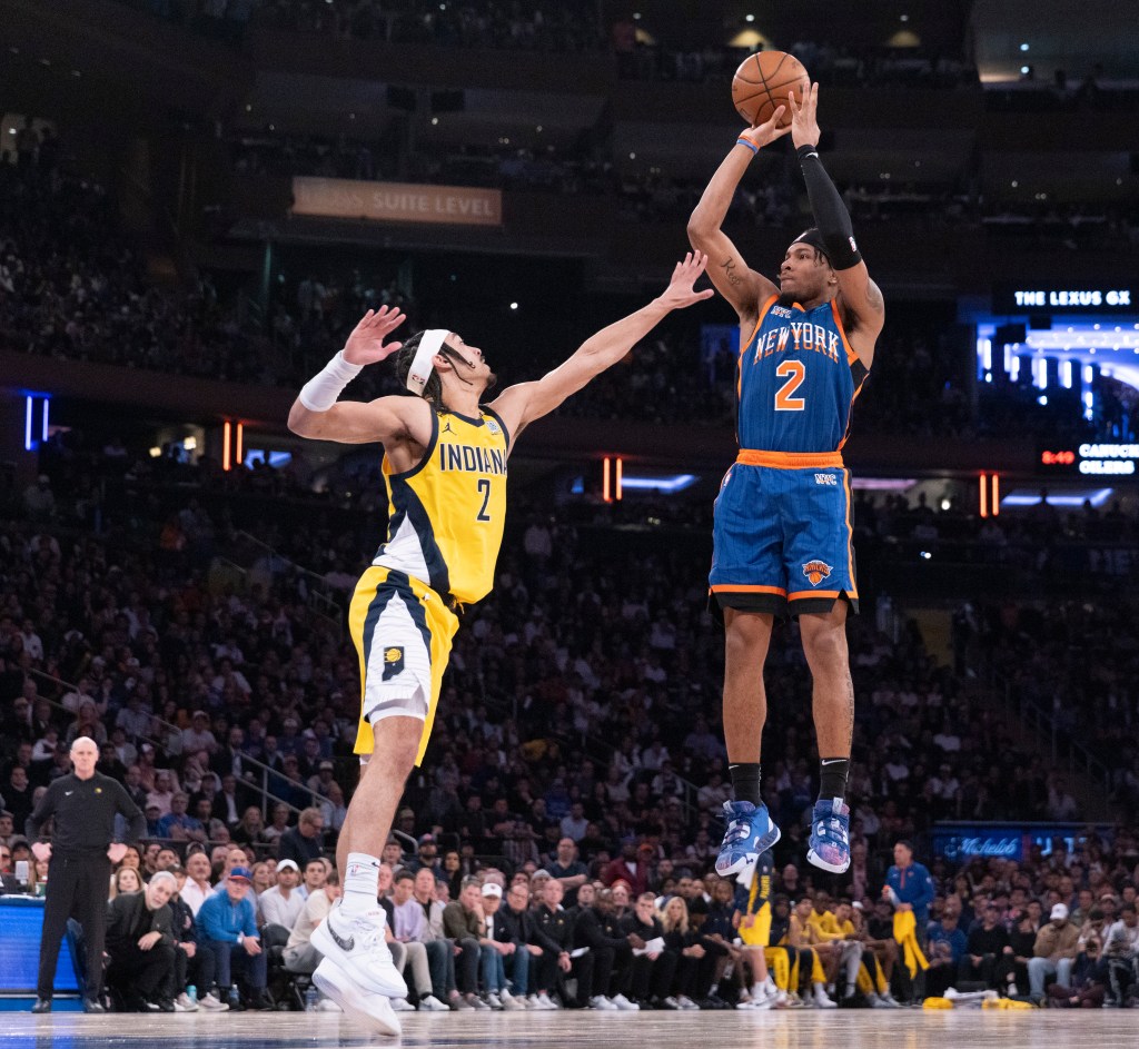 New York Knicks guard Miles McBride #2 puts up a shot over Indiana Pacers guard Andrew Nembhard #2 during the second quarter.
