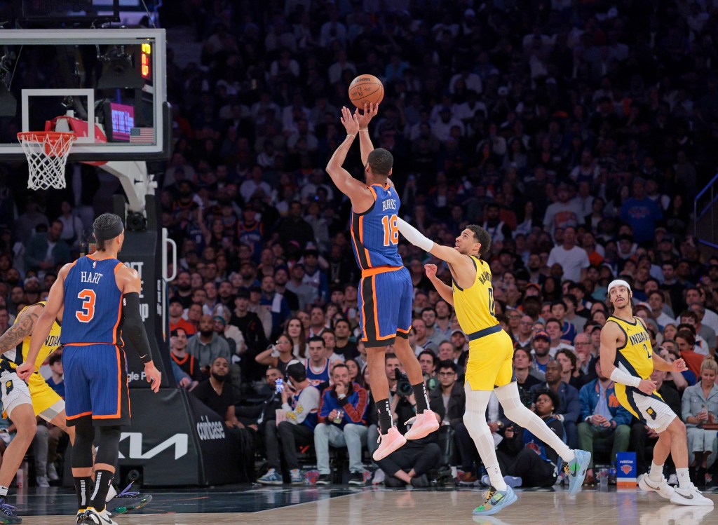 New York Knicks guard Alec Burks #18 puts up a shot in front of Indiana Pacers guard Tyrese Haliburton