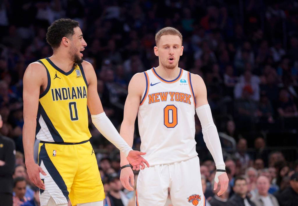  Pacers guard Tyrese Haliburton #0 reacts along side New York Knicks guard Donte DiVincenzo #0 during the second quarter of Game 7 on Sunday.