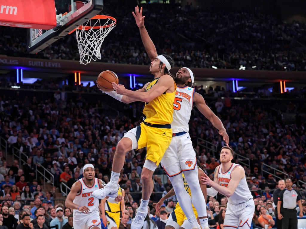 Pacers guard Andrew Nembhard #2 goes up for a shot as New York Knicks forward Precious Achiuwa #5 jumps to defend during the fourth quarter.