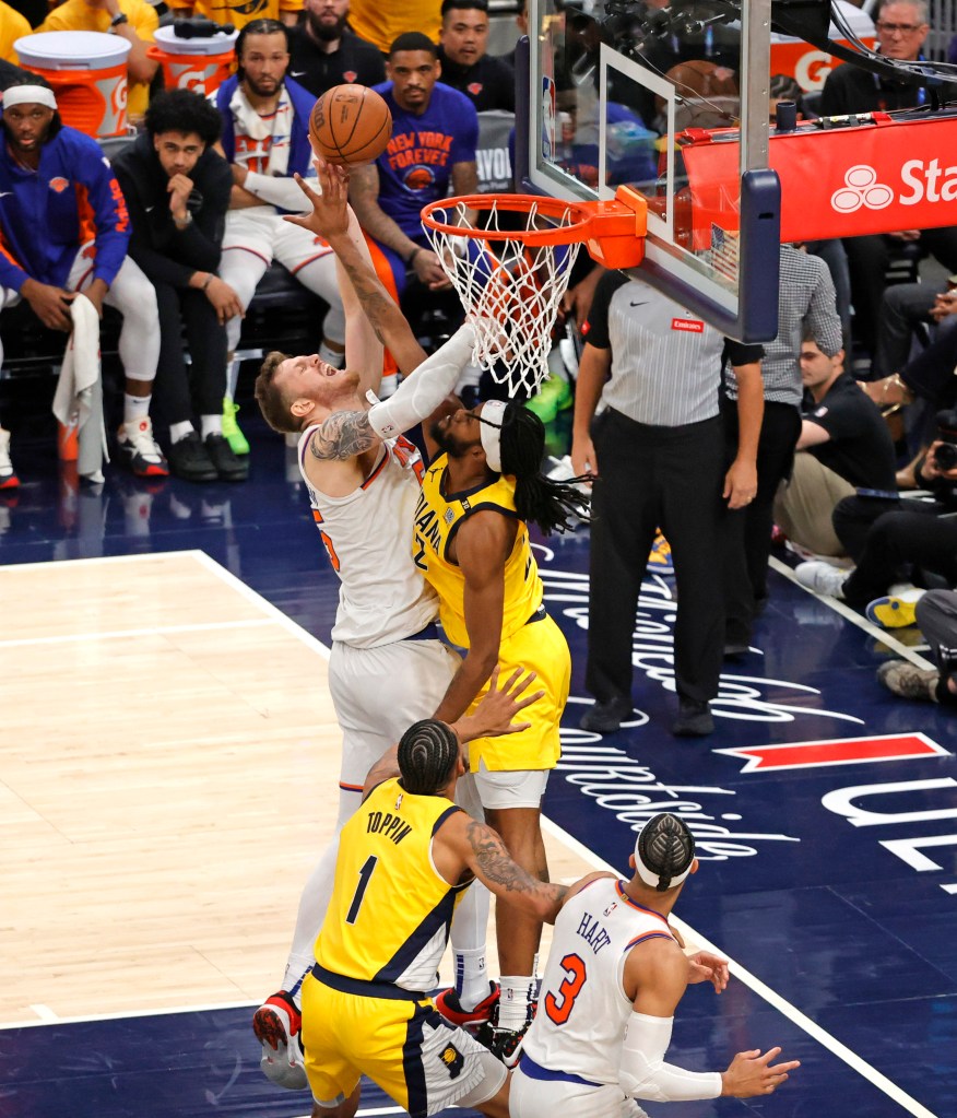 Isaiah Hartenstein #55 of the New York Knicks goes up for a shot as Andrew Nembhard #2 of the Indiana Pacers defends during the second quarter.