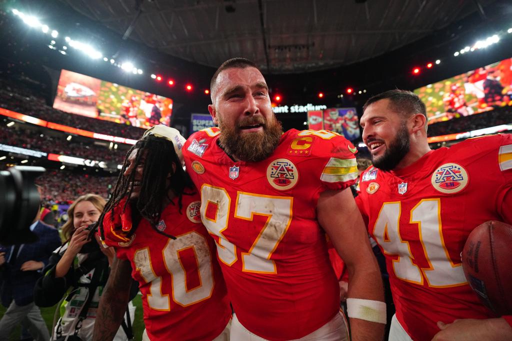 Chiefs tight end Travis Kelce (87), Isiah Pacheco (10) and James Winchester (41) celebrate after the Chiefs beat the 49ers in the Super Bowl at Allegiant Stadium on February 11, 2024 in Las Vegas, Nevada.