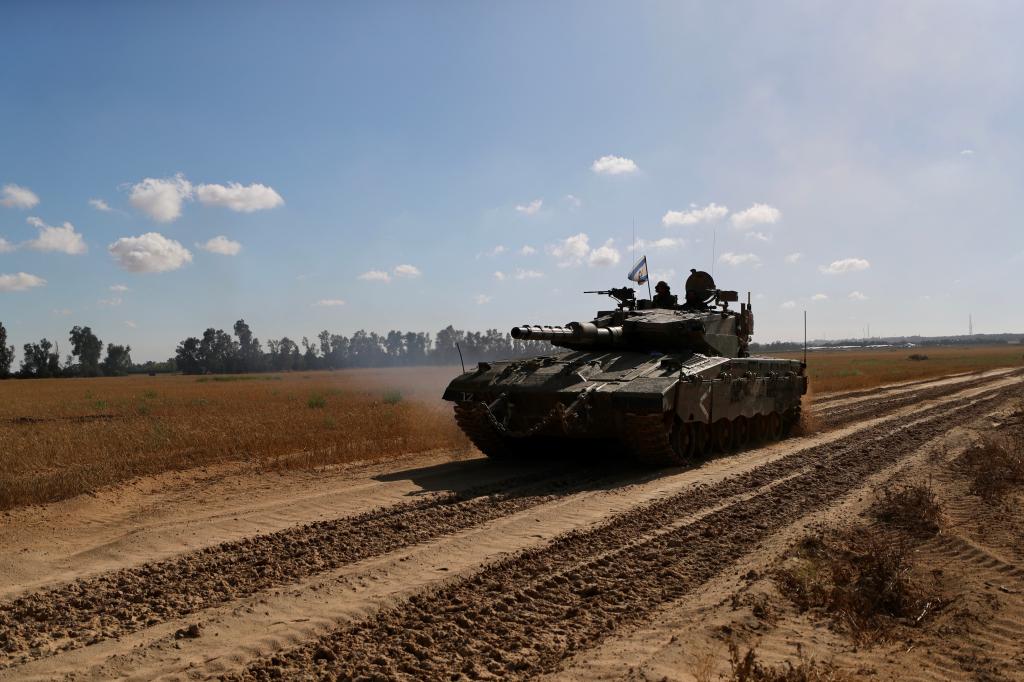 An Israeli tank is seen near the Shalom Kerem crossing in southern Israel near the border of the Gaza Strip on May 6, 2024.