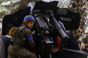 A Ukrainian soldier preparing to fire towards Russian troops in the Kharkiv region on May 21, 2024.