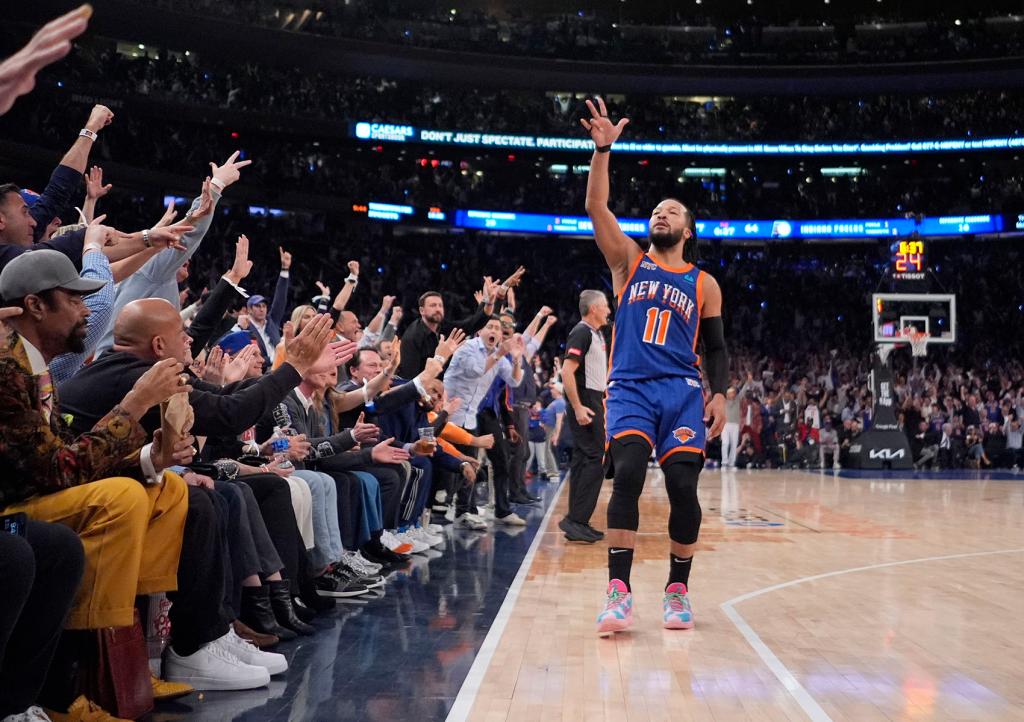 New York Knicks' Jalen Brunson (11) gestures to fans after making a three-point shot during the second half of Game 5 in an NBA basketball second-round playoff series against the Indiana Pacers, Tuesday, May 14, 2024, in New York. The Knicks won 121-91.