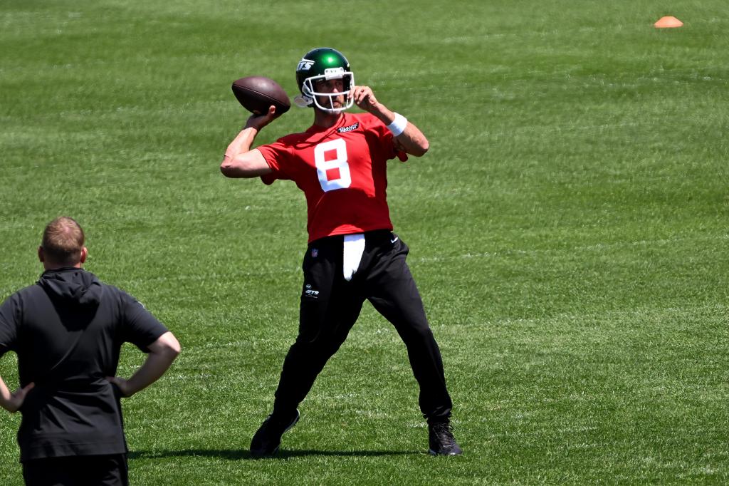 Aaron Rodgers, number 8 for the Jets, throwing a football during OTA's in Florham Park, NJ