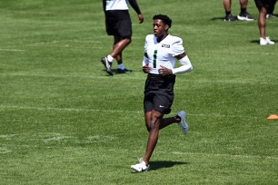 Jets' Sauce Gardner (1) runs during OTAs