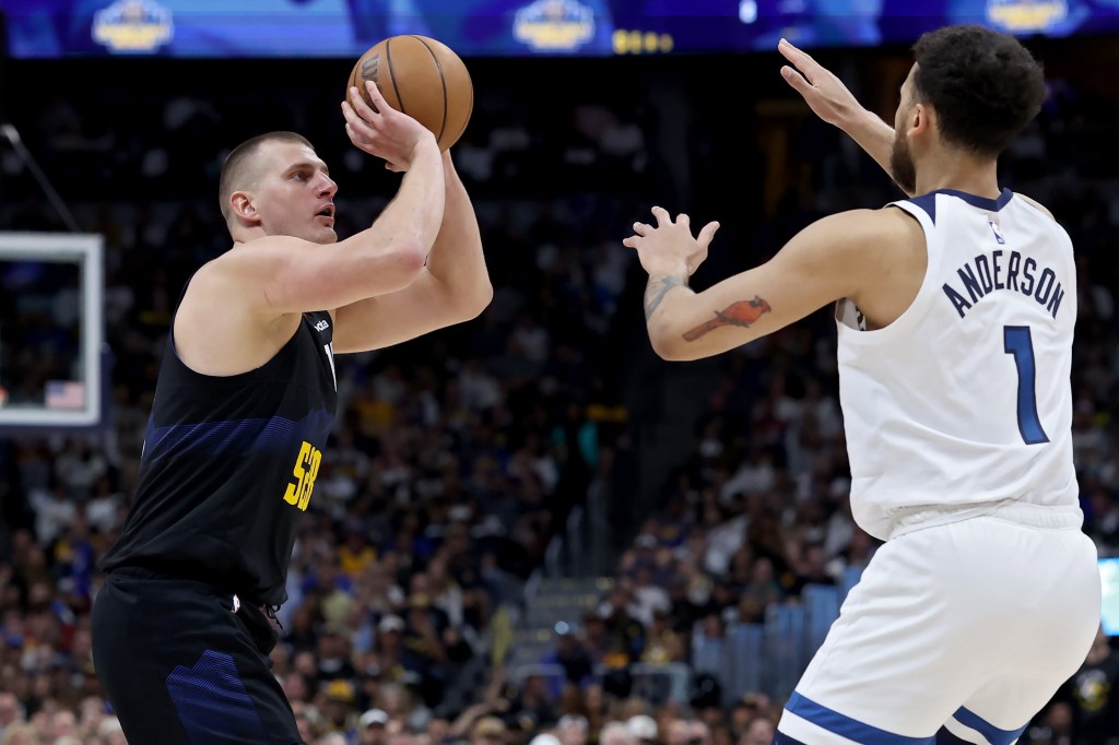 Nikola Jokic #15 of the Denver Nuggets shoots the ball against Kyle Anderson #1 of the Minnesota Timberwolves during the second quarter in Game Five of the Western Conference Second Round Playoffs at Ball Arena on May 14, 2024 in Denver, Colorado. 
