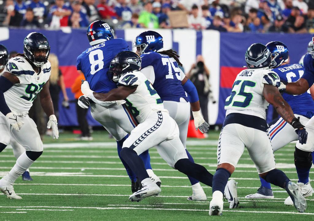 New York Giants quarterback Daniel Jones (8) sacked during the fourth quarter when the New York Giants played the Seattle Seahawks Monday, October 2, 2023 at MetLife Stadium in East Rutherford, NJ. New York Giants lost 24-3. 