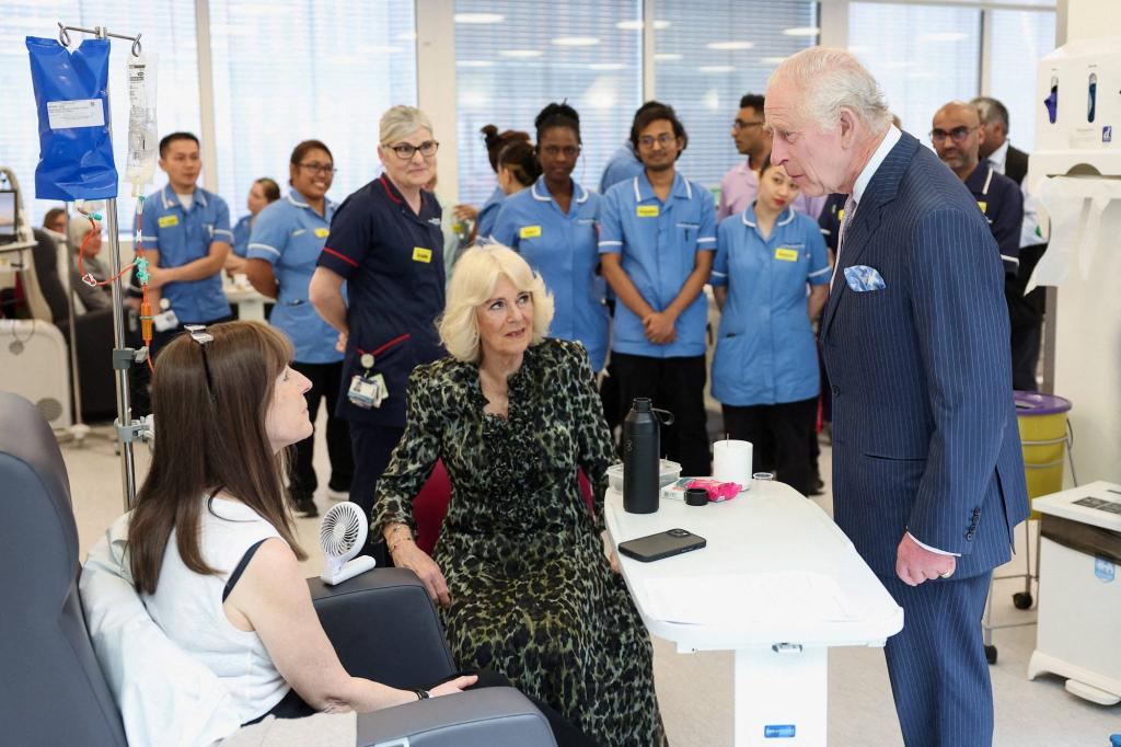 King Charles III and Queen Camilla observing a CT scanner alongside Cancer Research UK's Chief Clinician, Charlie Swanton, during their visit to the University College Hospital Macmillan Cancer Centre in London, England.