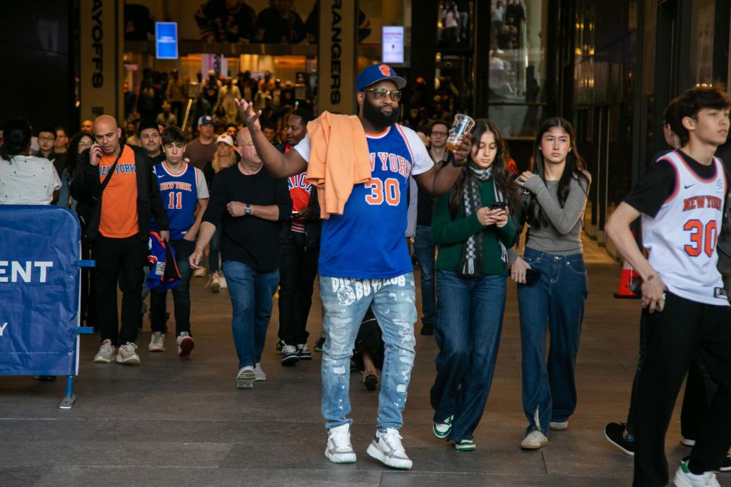 Knicks fans react to the Knicks losing to the Indiana Pacers in the eastern conference semi-finals playoffs in front of Madison Square Garden.