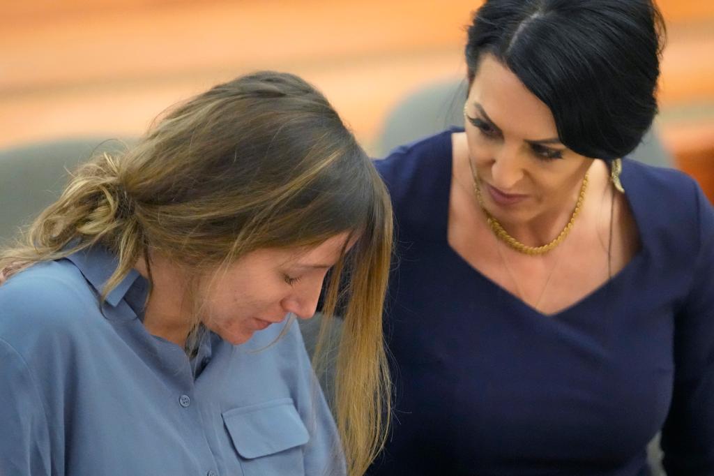 Kouri Richins, left, a Utah mother of three who authorities say fatally poisoned her husband, Eric Richins, then wrote a children's book about grieving, speaks with her attorney Skye Lazaro during a status hearing Friday, Sept. 1, 2023, in Park City, Utah.