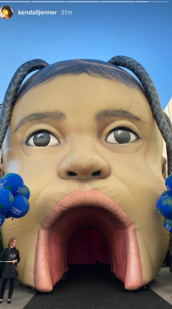 Large inflatable baby face with blue balloons at Stormi's 2nd birthday party thrown by Kylie Jenner