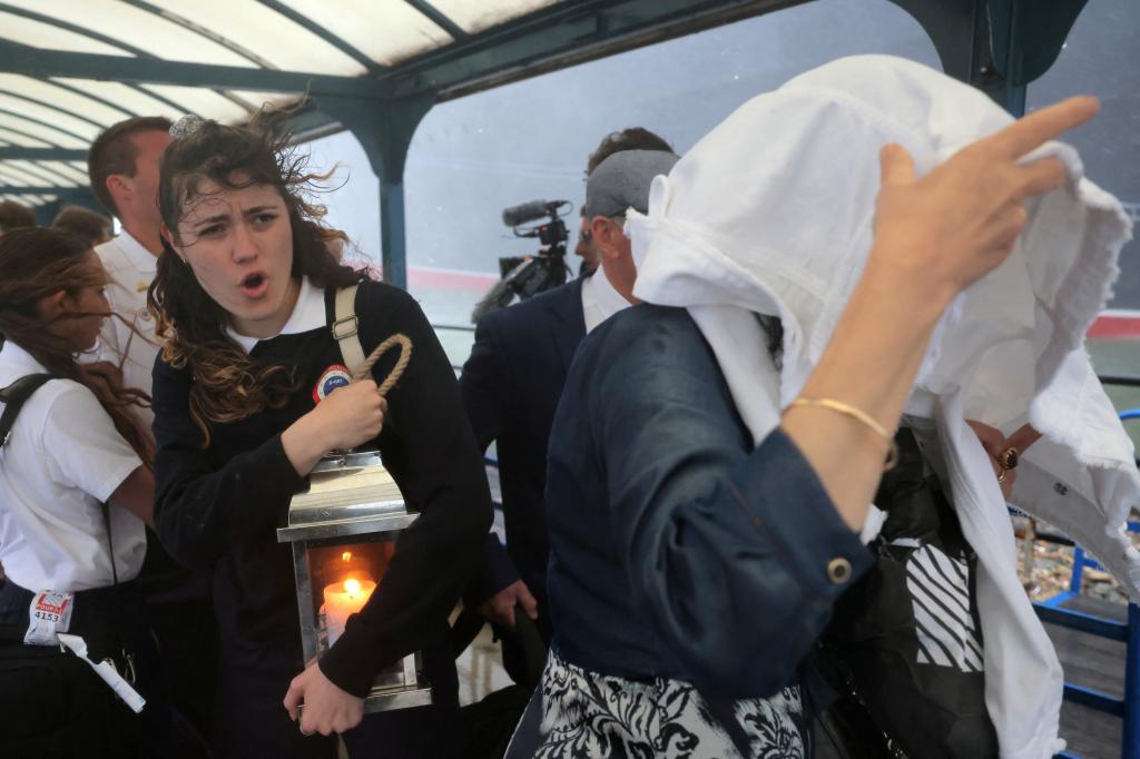 A delegation from France arriving in Brooklyn on the Queen Mary 2 for the D-Day ceremony.