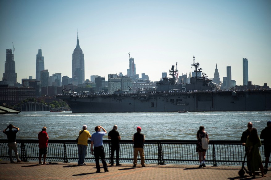 USS Bataan passes by the Empire State Building and Midtown Manhattan.