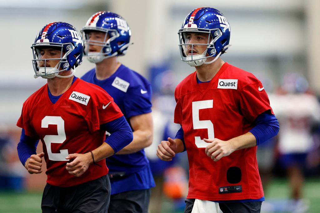 Quarterbacks Liam Thompson #2 and Ben Bryant #5 of the New York Giants run drills during New York Giants Rookie Minicamp at Quest Diagnostics Training Center on May 10, 2024 in East Rutherford, New Jersey. 