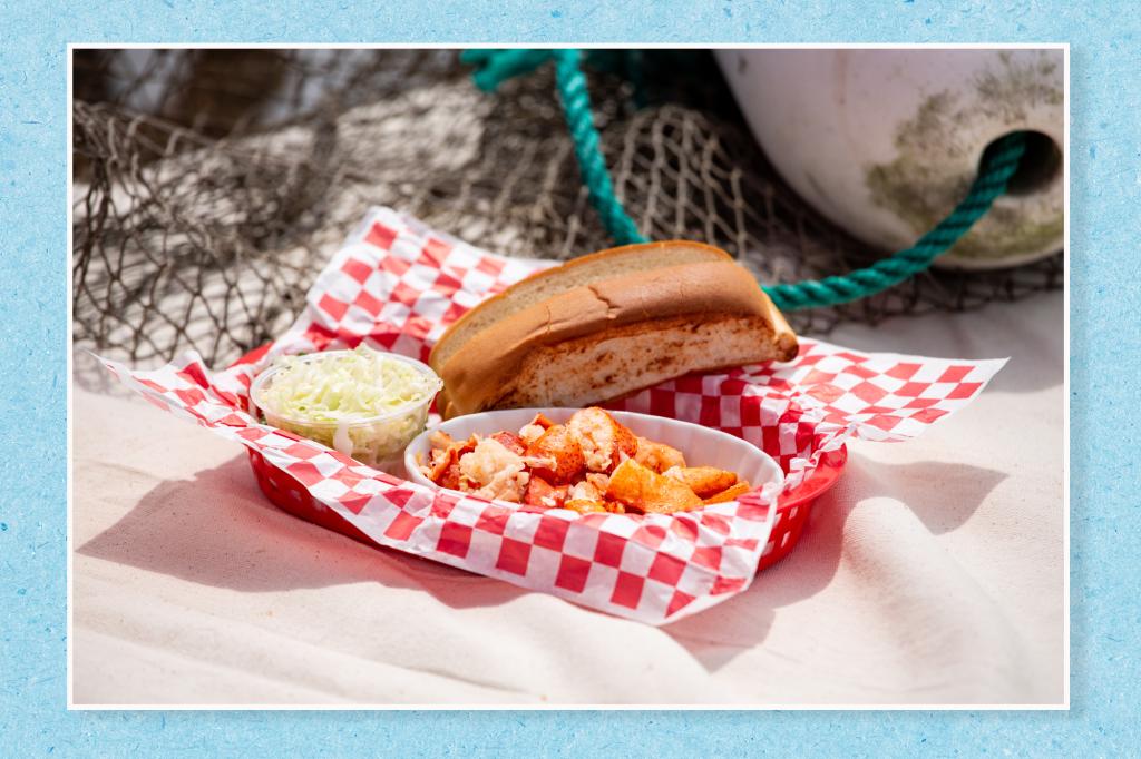 A lobster roll on a blue paper texture background