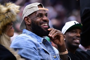 LeBron James smiles during the first half of Game 4 