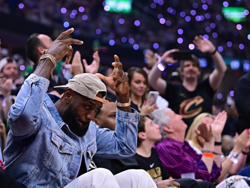 LeBron James, left, acknowledges the crowd during the first half Monday night.