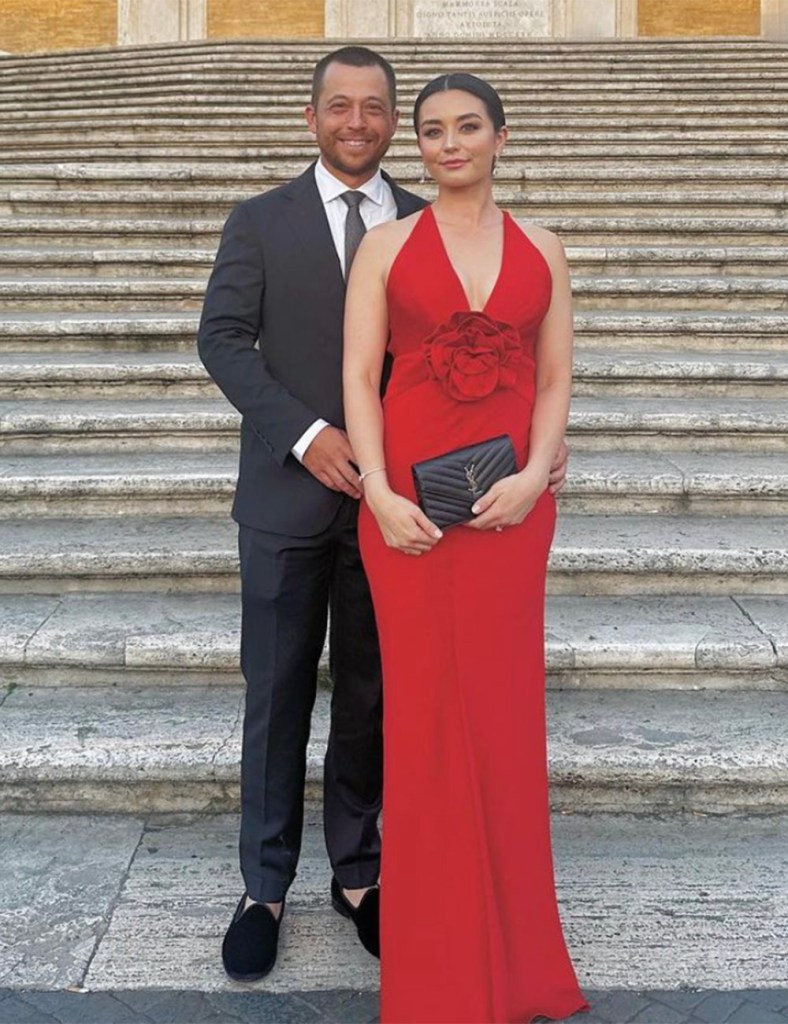 Xander Schauffele and  his wife Maya Lowe pose for photos at The Spanish Steps in Rome, Italy, for the 2023 Ryder Cup in September. 