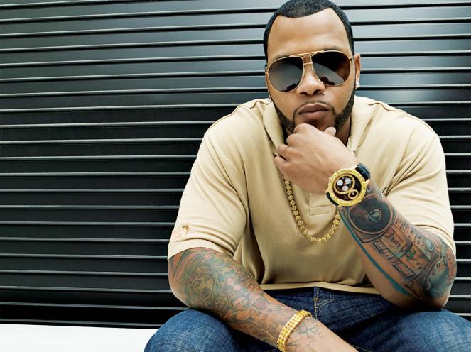 Flo Rida, a man with tattoos on his arm, photograph by Mark Mann for Sunday Features