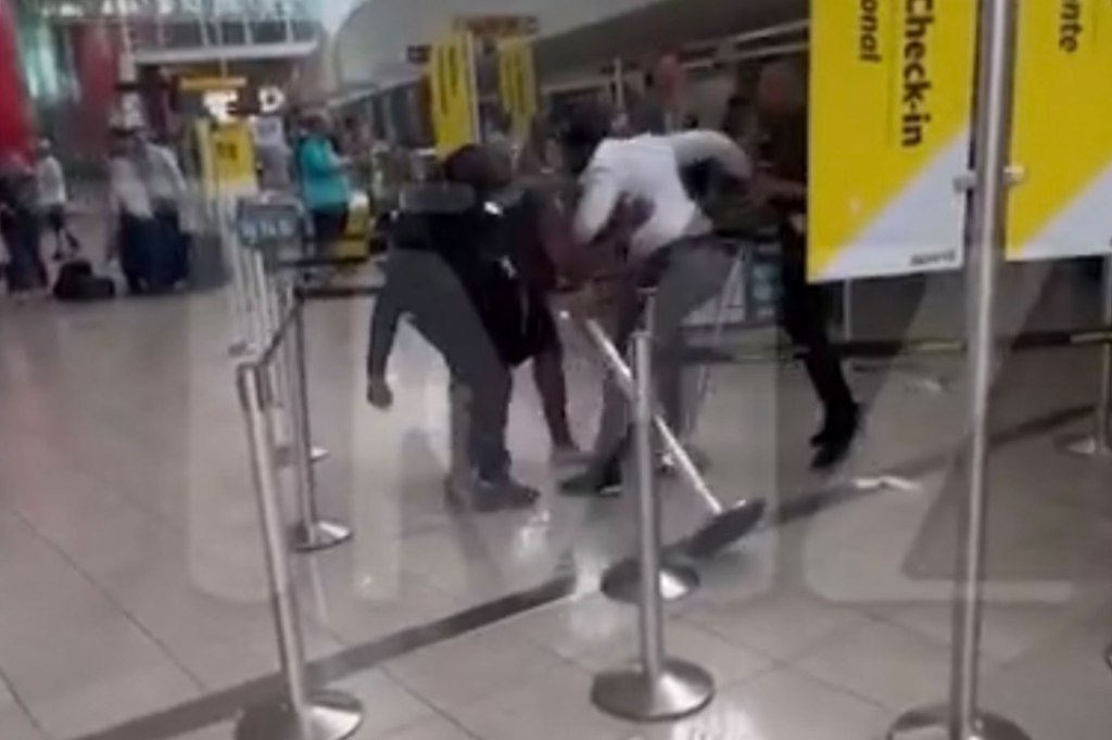Cell phone footage of a fight at an airport ticket counter in Baltimore