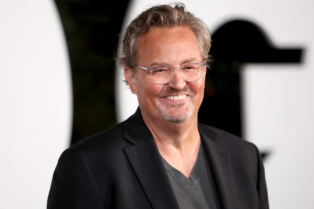 Matthew Perry in a black suit attending the GQ Men of the Year Party 2022 in West Hollywood, California.