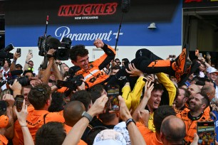 McLaren's British driver Lando Norris is tossed in the air as his team celebrates his victory in the 2024 Miami Formula One Grand Prix 