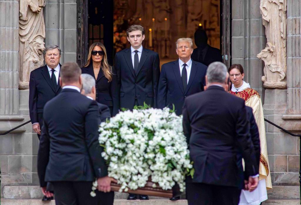 Barron Trump stands besides his parents during before the funeral of Melania Trump's mother Amalija Knavs on Jan. 18, 2024.