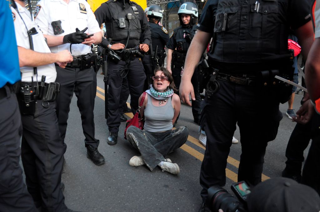 New York City Police Department officers arresting a pro-Palestine demonstrator at a march in Manhattan, New York City