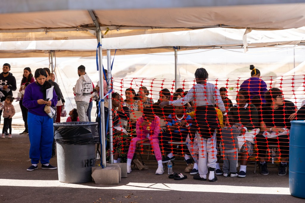 Migrants arrive at the Regional Center for Border Health in Yuma, Arizona, after being released by Border Patrol.
