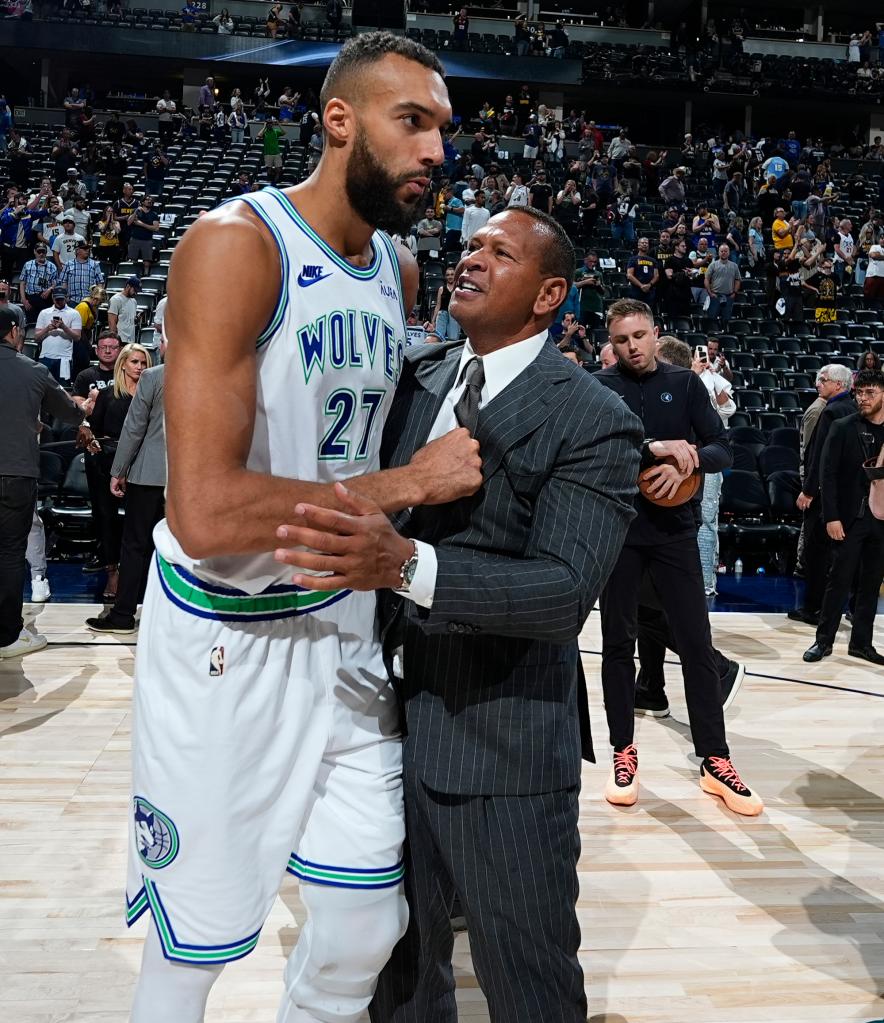 Minnesota Timberwolves center Rudy Gobert, left, is congratulated by team minority owner Alex Rodriguez after Game 7.