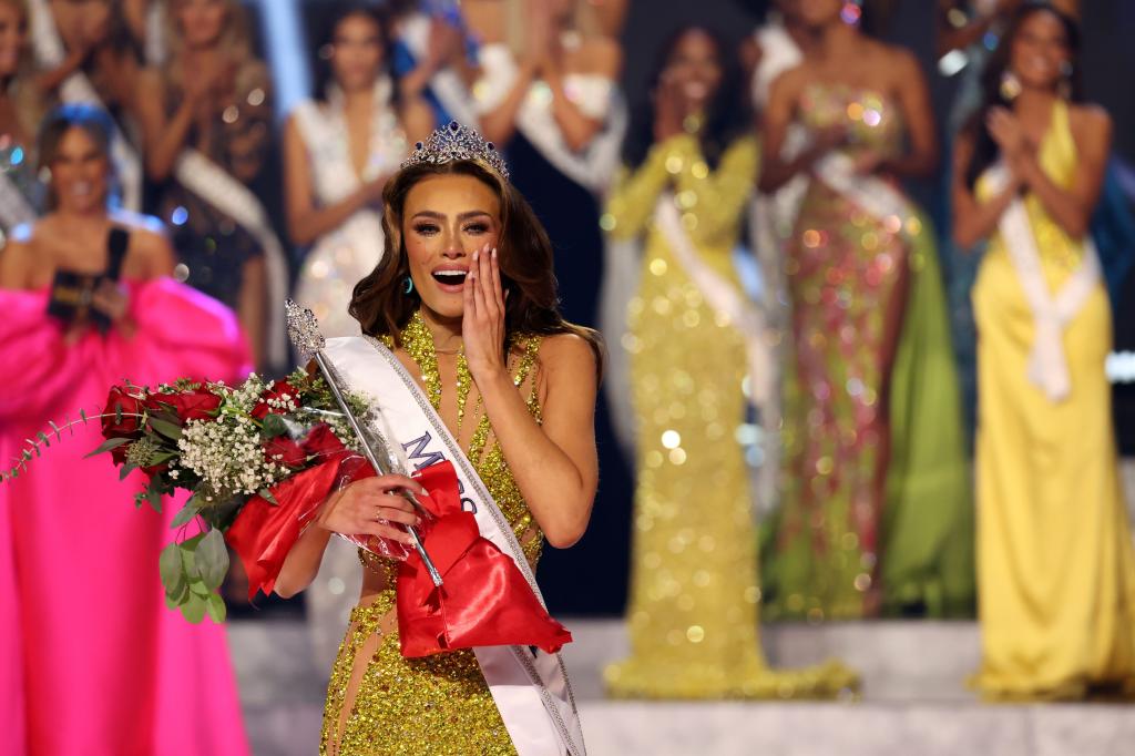 Noelia Voigt, Miss Utah USA 2023, wearing crown and tiara while holding flowers and a sash after being crowned as Miss USA at 72nd Miss USA Pageant in Reno, Nevada