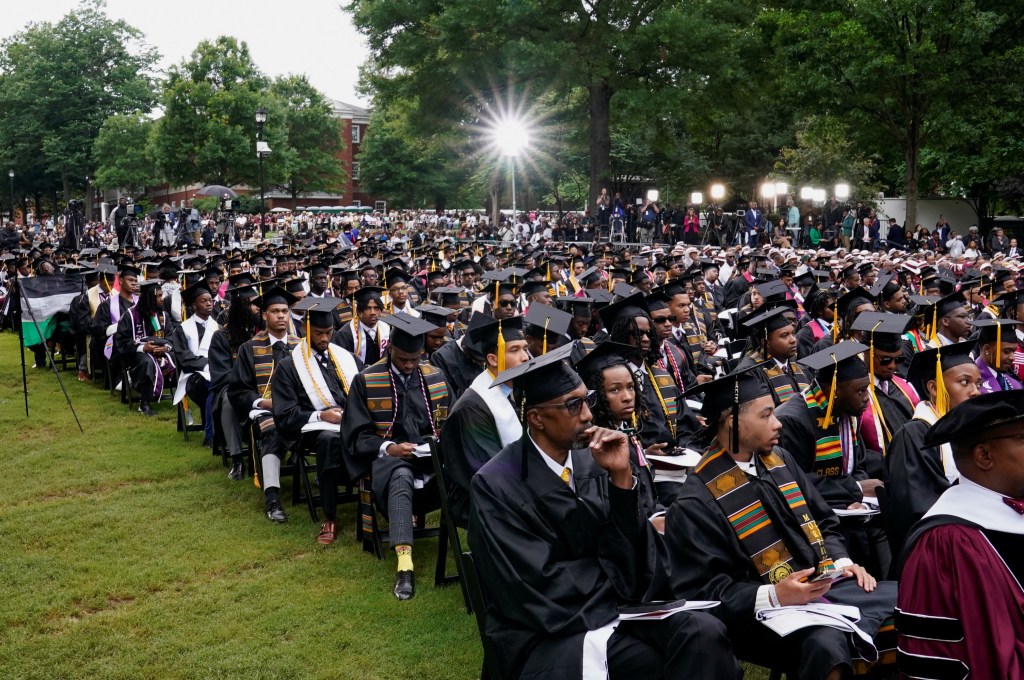 Morehouse College graduates in gowns and caps listening to U.S. President Joe Biden's speech at their commencement ceremony in Atlanta, Georgia, May 19, 2024