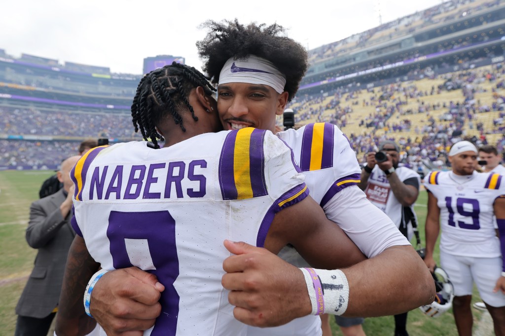 Jayden Daniels #5 and Malik Nabers #8 of the LSU Tigers celebrate after a game against the Texas A&M Aggies at Tiger Stadium on November 25, 2023 in Baton Rouge, Louisiana.