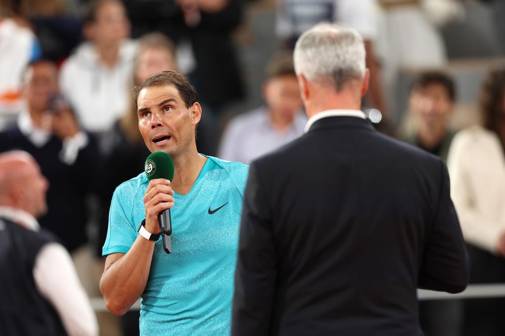 Rafael Nadal addresses the crowd following his match Monday.