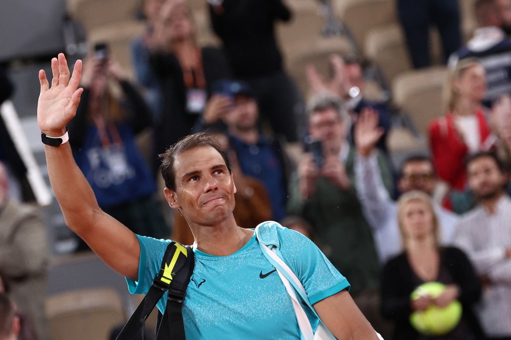 Rafael Nadal waves to the crowd after his French Open loss Monday.