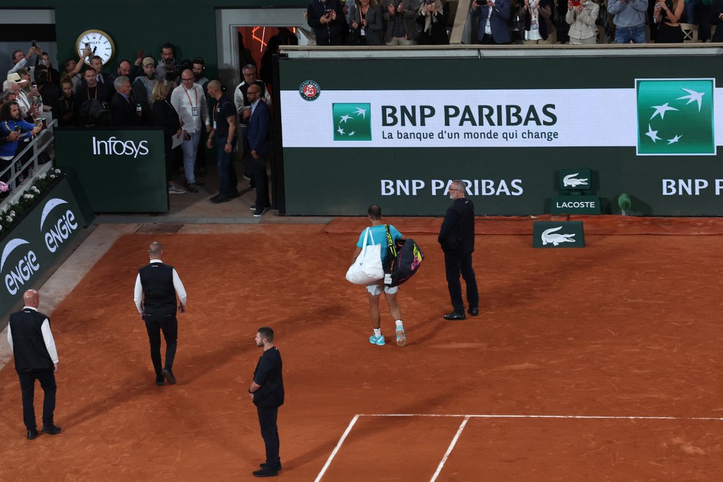 Rafael Nadal walks off the court at Roland Garros on Monday.