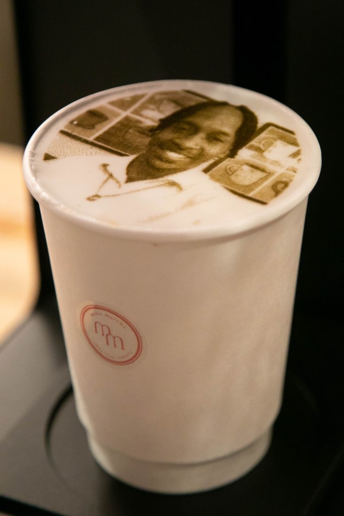 Nate Myles of Harlem coffee selfie , a recreation of a smiling selfie of myles in foam on the top of his coffee