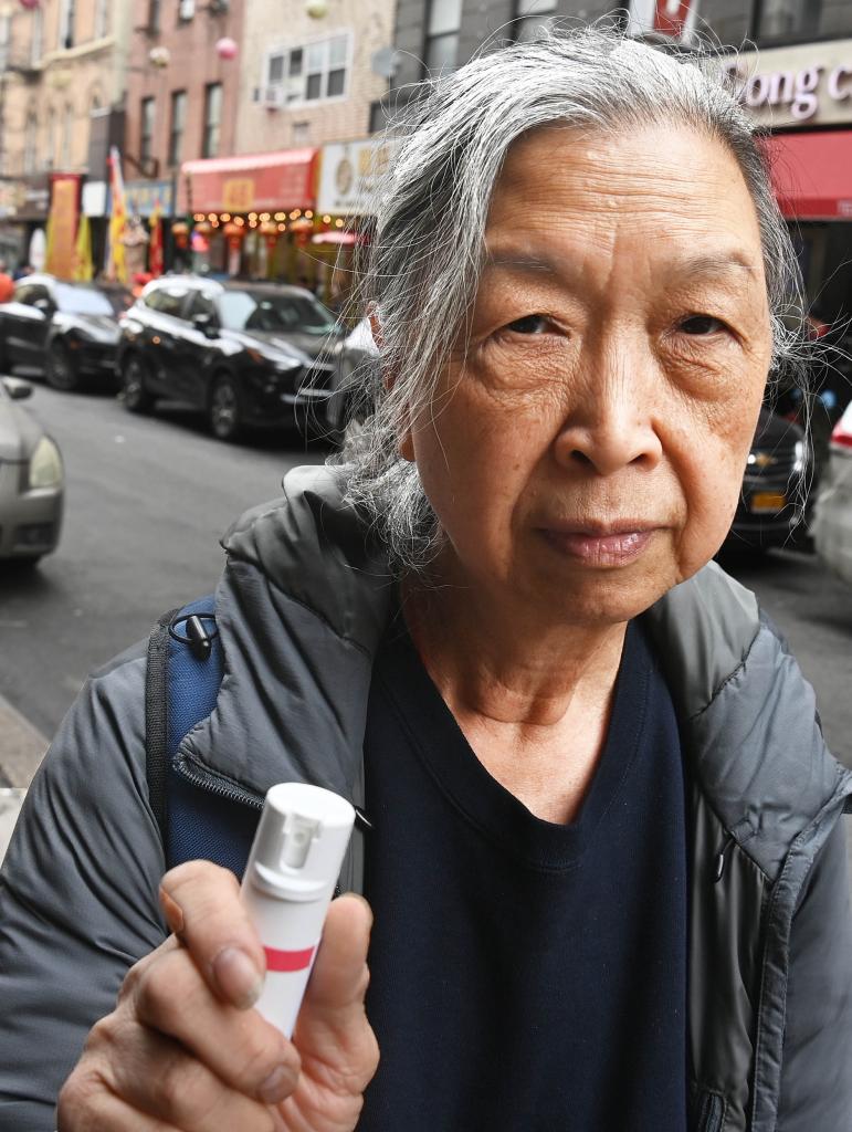 A photo of Karen Wong, 75, with a cannister of pepper spray.