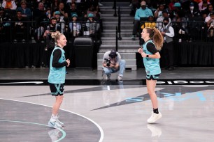 Courtney Vandersloot #22 and Sabrina Ionescu #20 of the New York Liberty as they host an open practice and media day ahead of their 2024 season at Barclays Center .