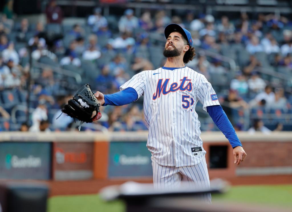 Mets relief pitcher Jorge Lopez throws his glove after being taken out of game against the Los Angeles Dodgers