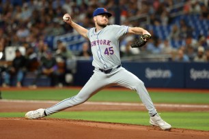 Christian Scott pitches during the Mets' loss to the Rays on May 4, 2024. 