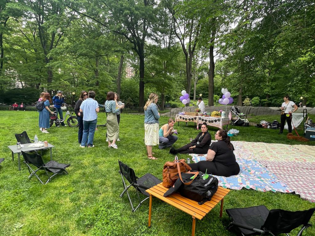 An NYU graduate throws a party in Central Park at West 81st. St. and Central Park West on May 17, 2024.