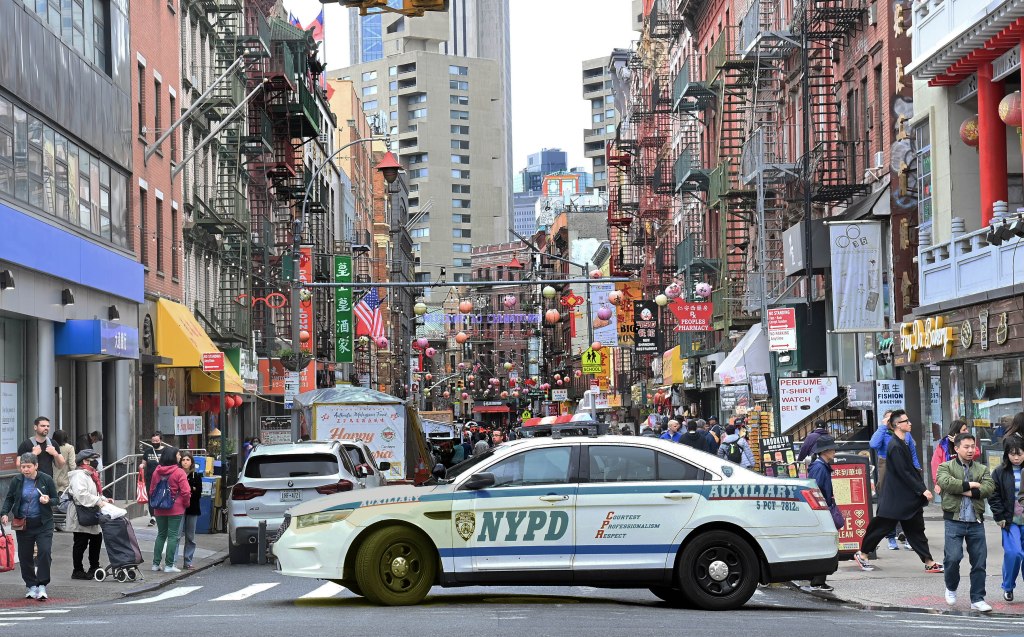 A photo of an NYPD auxiliary patrol car in Chinatown.