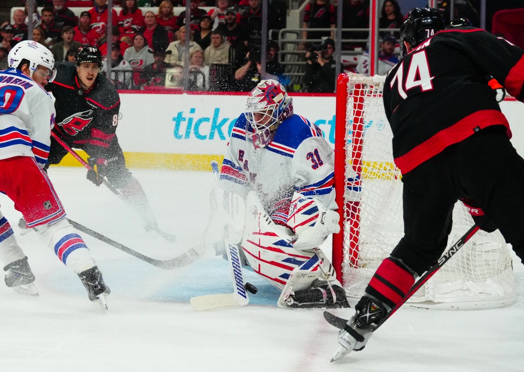 Rangers goaltender Igor Shesterkin (31) stops the shot by Carolina Hurricanes defenseman Jaccob Slavin (74) during the third period.