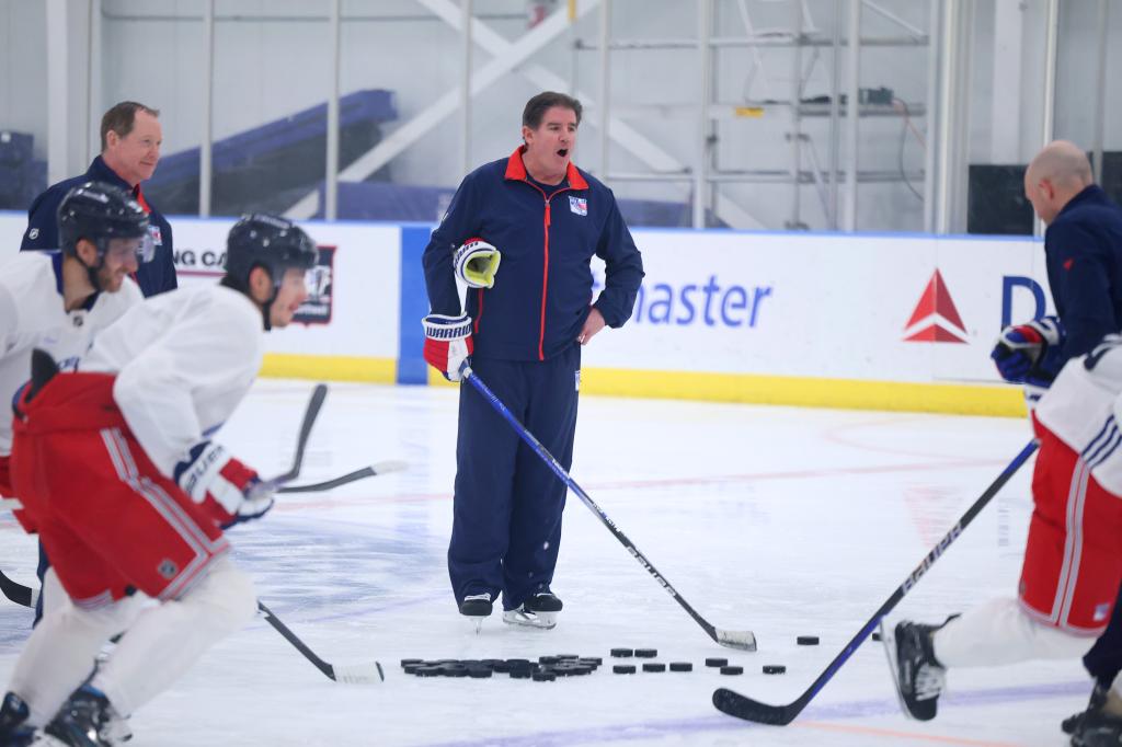 Rangers head coach Peter Laviolette leads his team thru practice