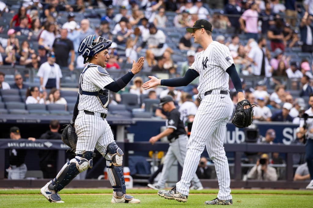 Jose Trevino congratulates pitcher Clay Holmes in the ninth inning against the Chicago White Sox at Yankee Stadium, Sunday, May 19, 2024, in Bronx, NY.