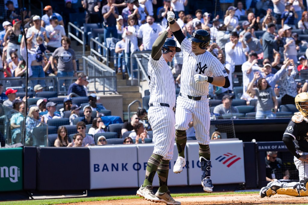 The Yankees'Jon Berti celebrates his three-run home run with Anthony Rizzo.