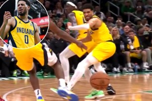 Tyrese Haliburton (0) reacts against the Boston Celtics in the first half during game two of the eastern conference finals for the 2024 NBA playoffs at TD Garden.